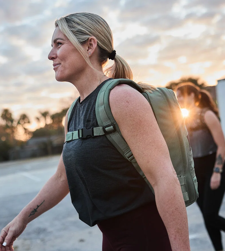 Nichele Cihlar hiking with a weighted backpack during a rucking walk.