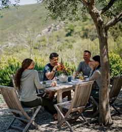 group eating around table outside