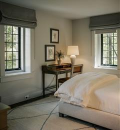 A bedroom with blackout window shades