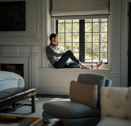 Man sitting at window 