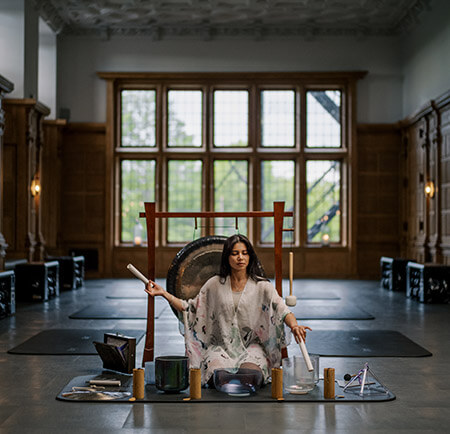 Woman using sound therapy tools